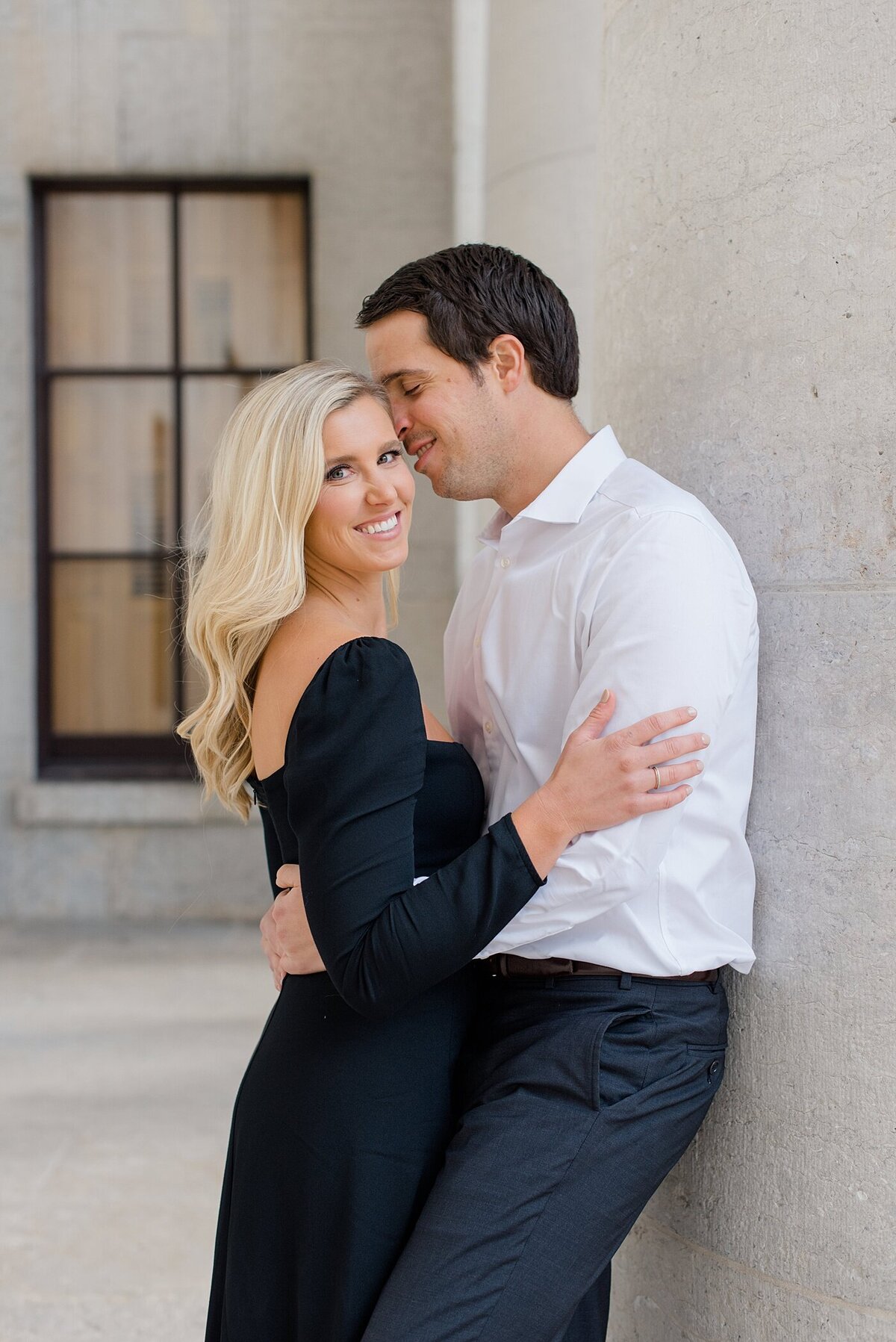 Groom smiling at bride at Ohio State House engagement session by Ohio Wedding Photographer
