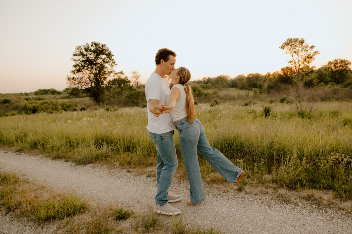 couple kissing during engagement photos in missouri