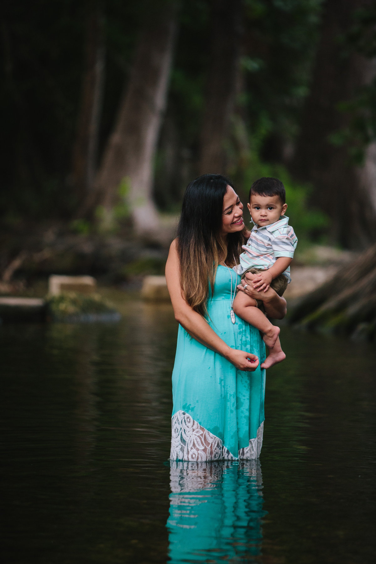 mother and son standing in river for a family photography photoshoot by San Antonio photographer Expose The Heart
