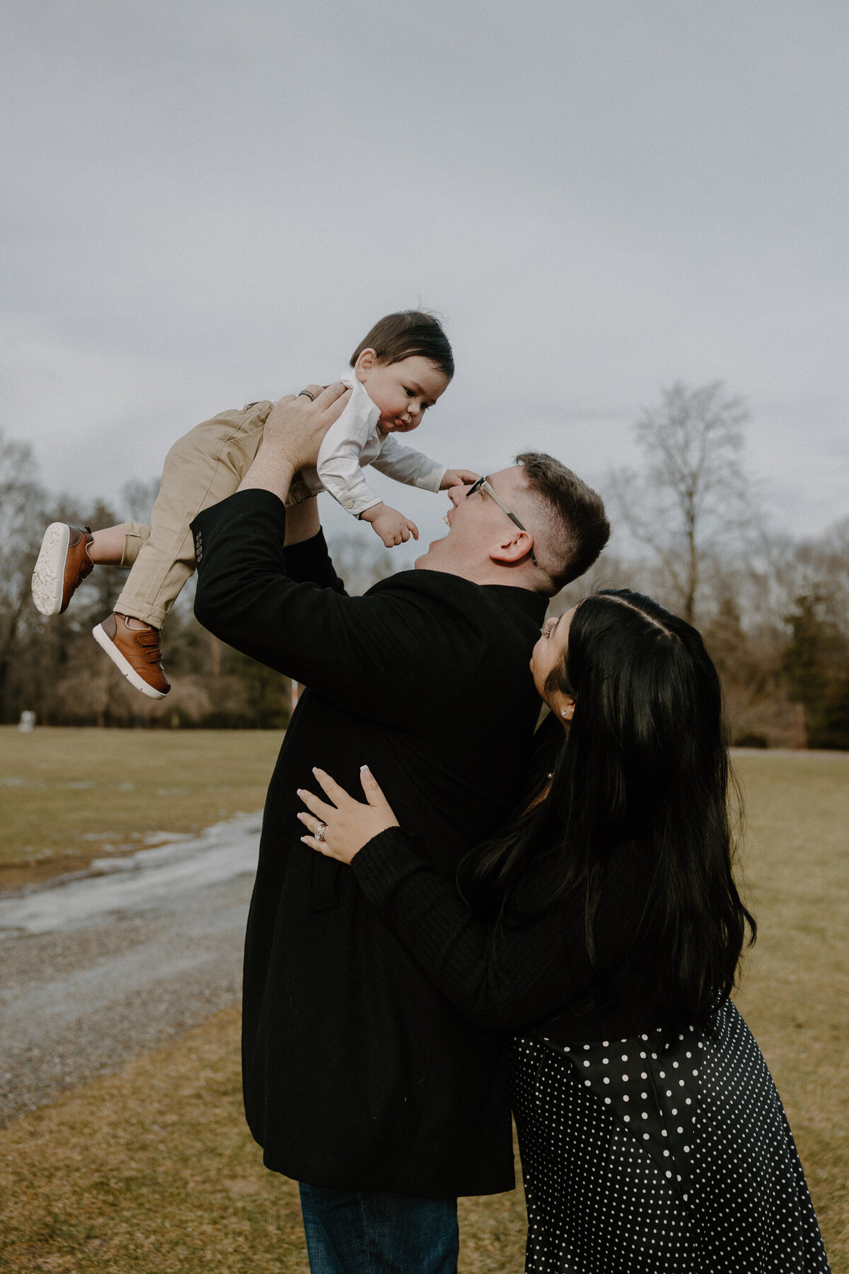 dad holding up son