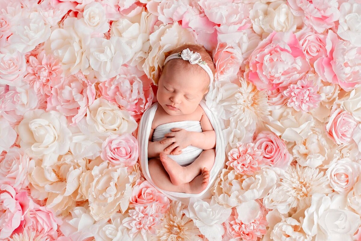 mobile-in-home-newborn-photography-vancouver-fraser-valley_baby-girl-pink-cream-flower-next