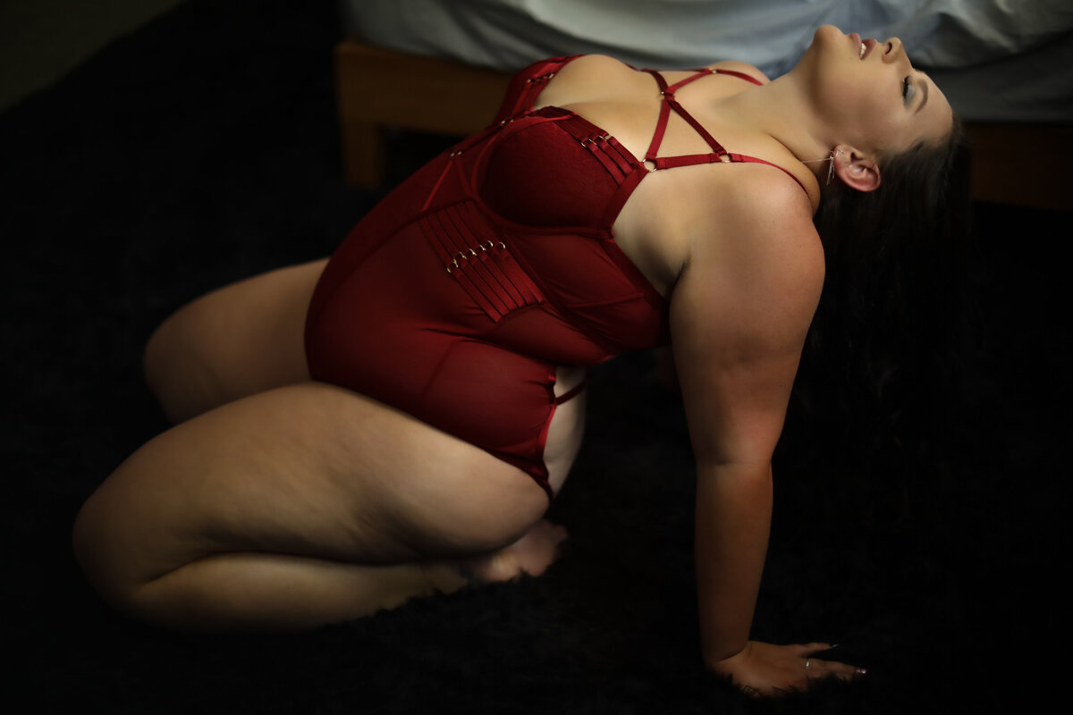 Casey Heather boudoir-bradenton-sarasota-longboat key-florida-dark and moody-sexy-lingerie-shorts-red-strappy-plus size