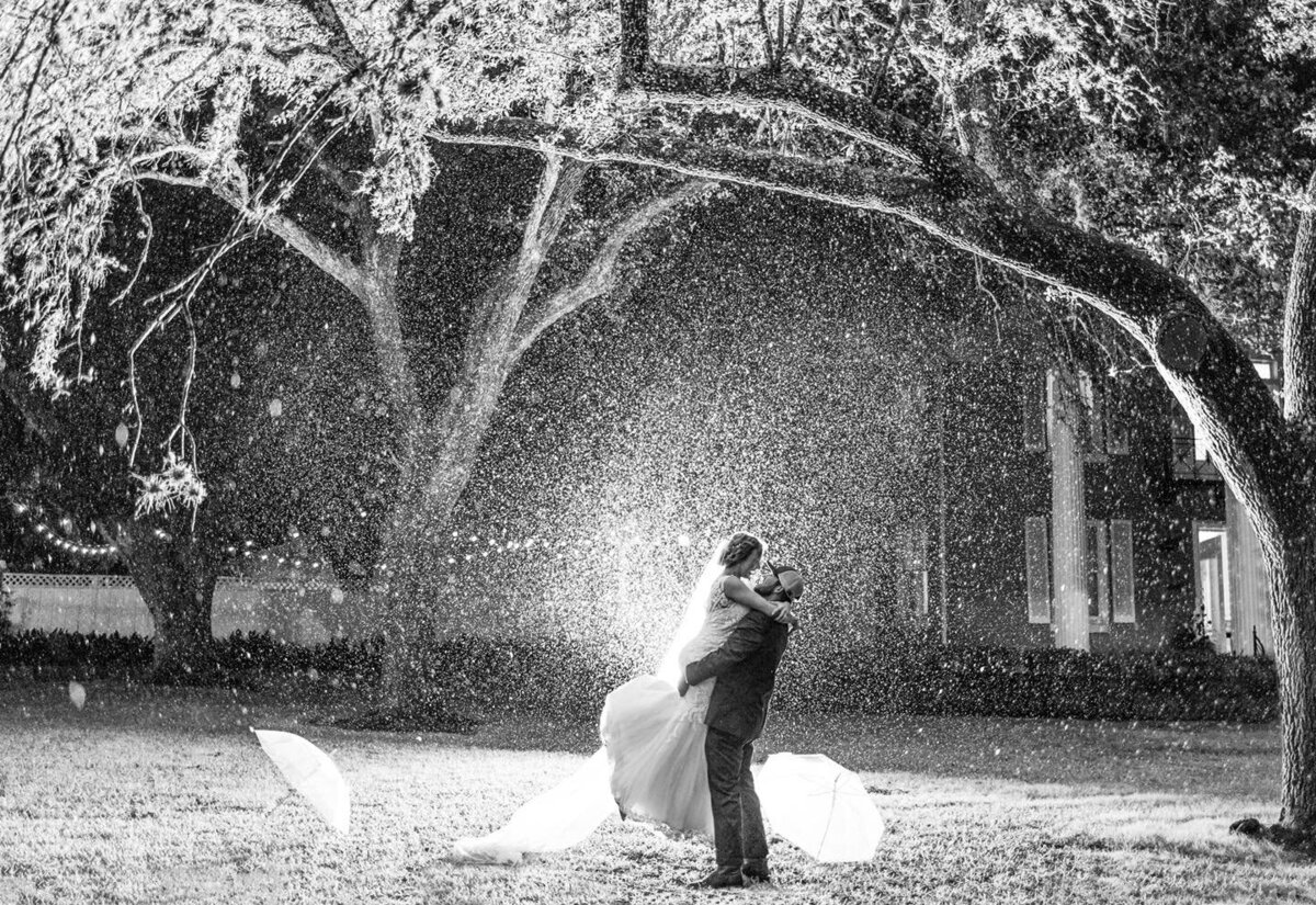 couple holding each other in the rain