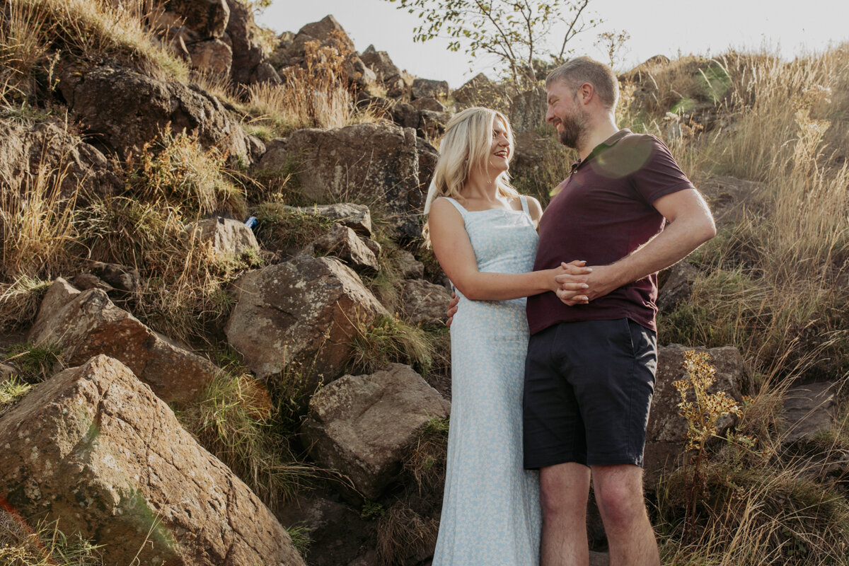 A couple having an engagement photo in Edinburgh at Arthurs seat