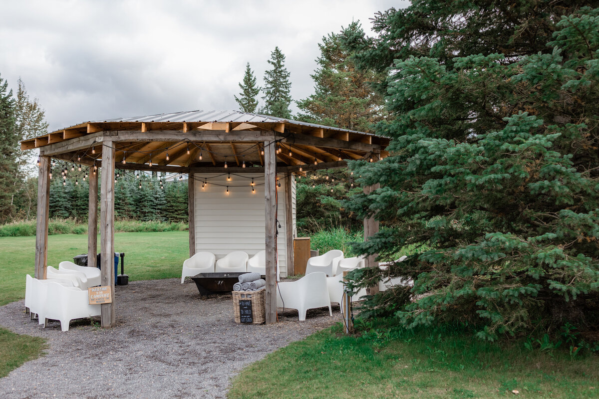 Gorgeous seating area at Pine & Pond, a natural picturesque wedding venue in Ponoka, AB, featured on the Brontë Bride Vendor Guide.