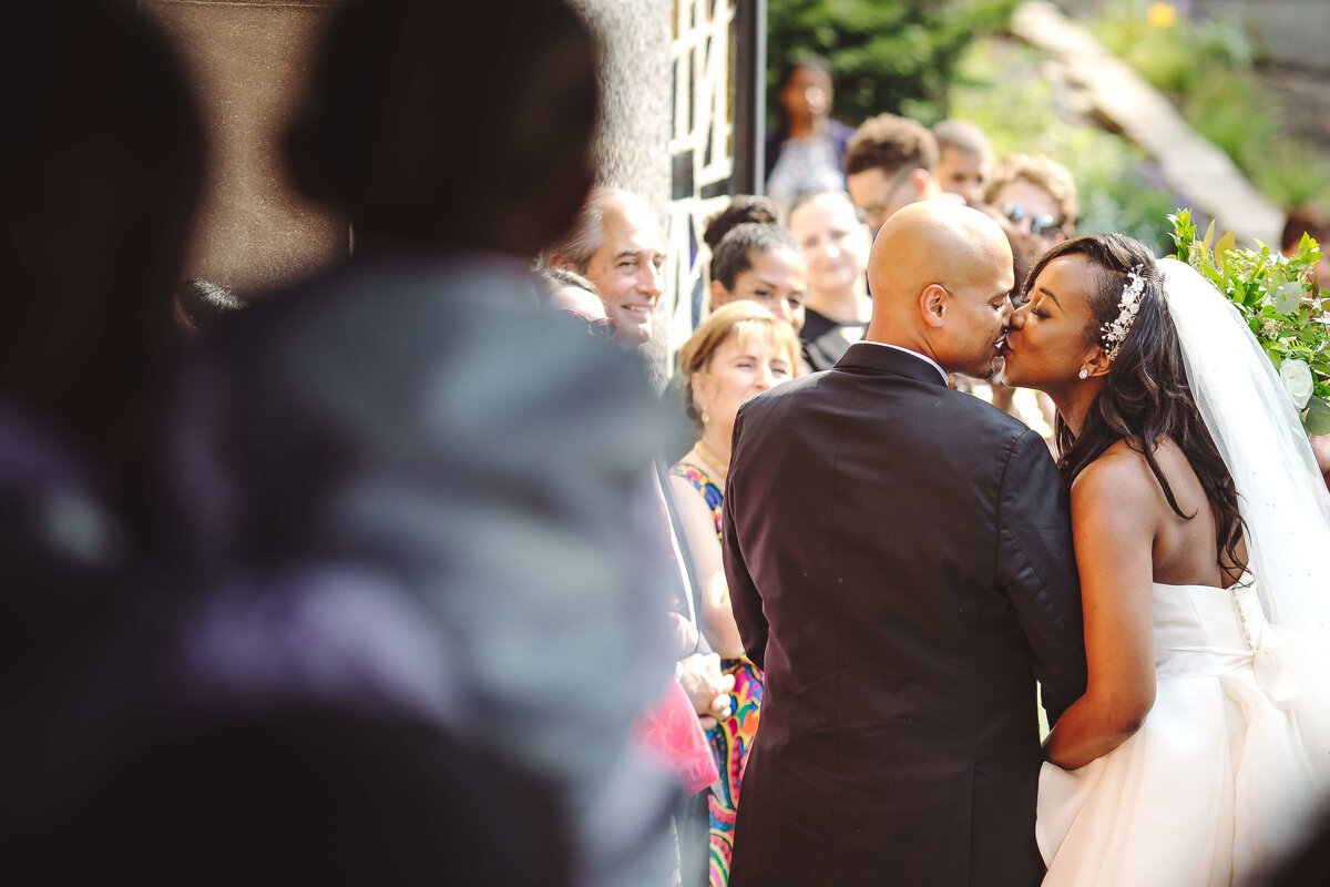black wedding couple kiss