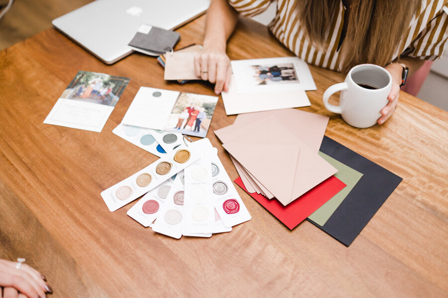 woman sorting through color swatches