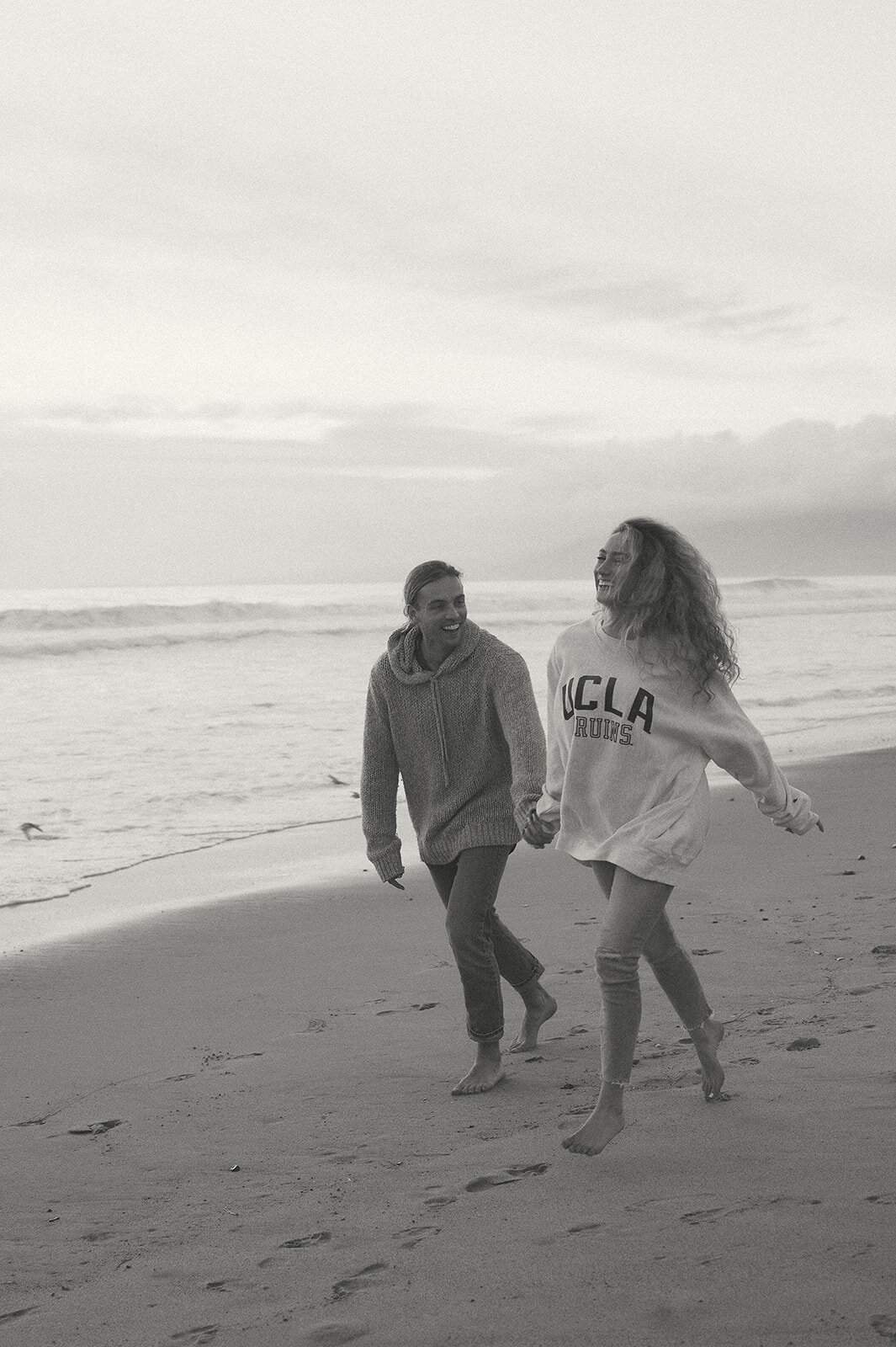 photos of couple on beach in southern california