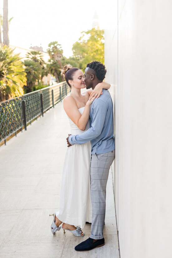 engaged-couple-hugging-by-Timkin-Building-balboa-park-san-diego