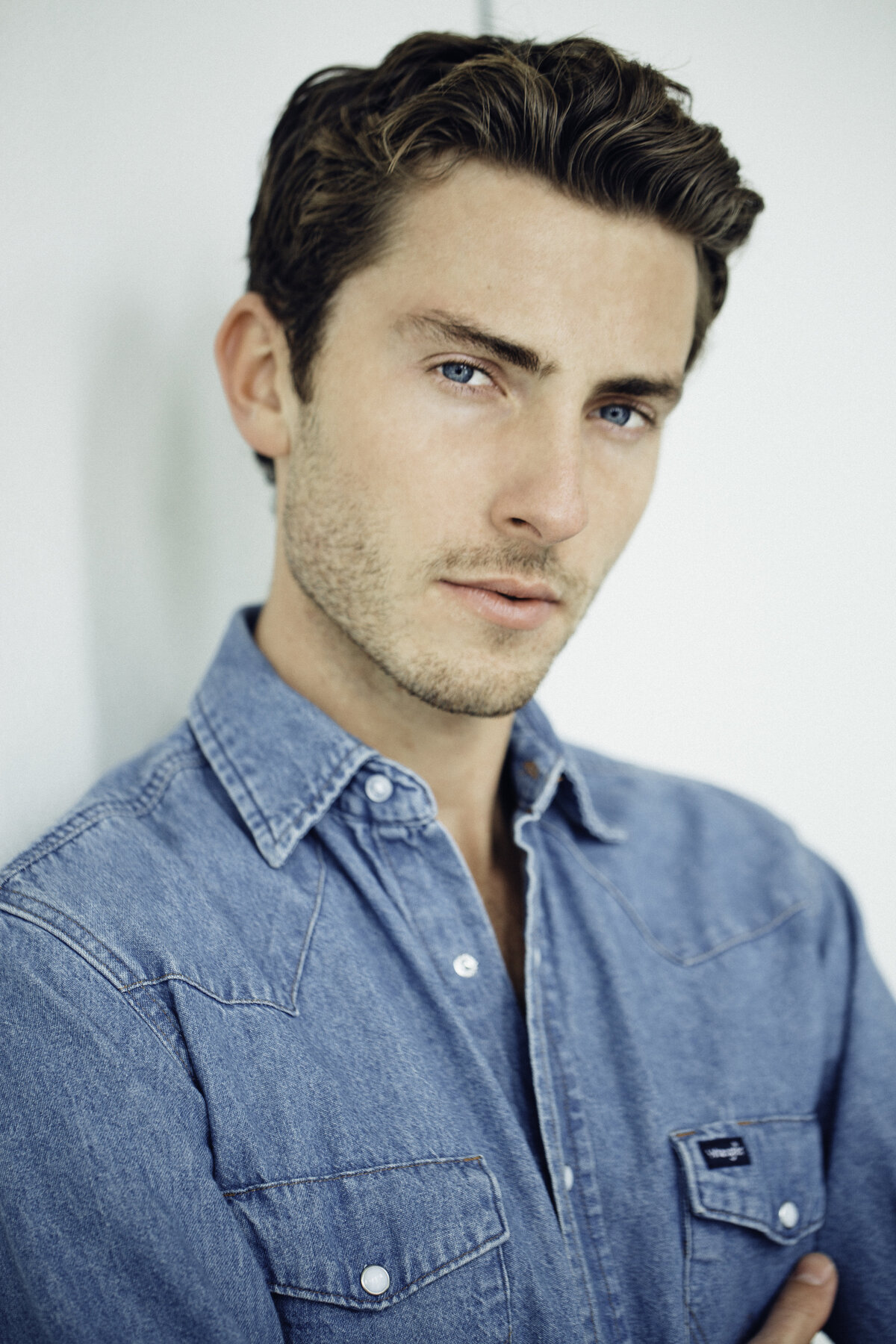 Headshot Photograph Of Young Man In Blue Denim Polo Los Angeles