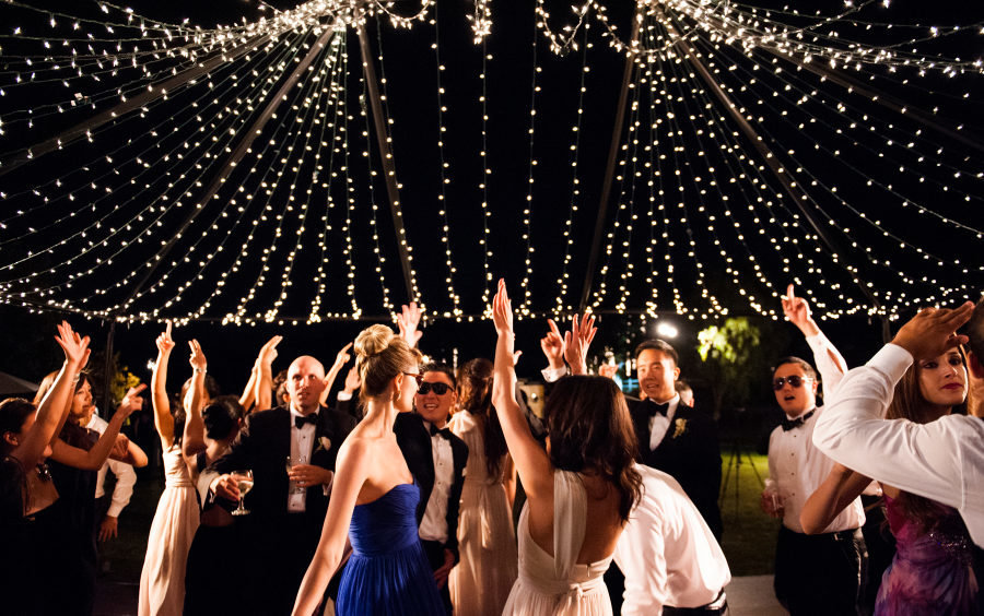 guests dancing under a sea of lights
