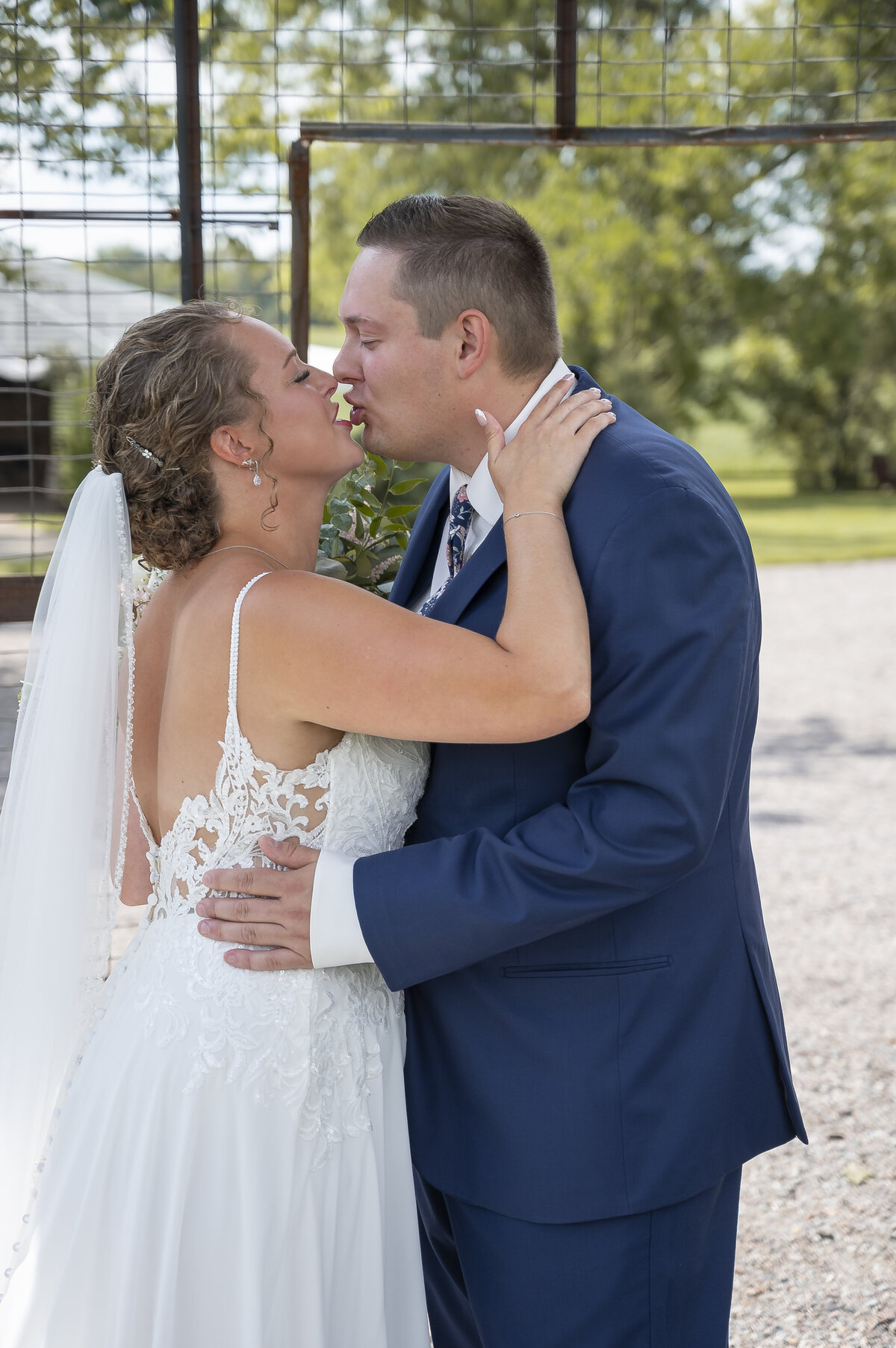 Couple hug at forest wedding