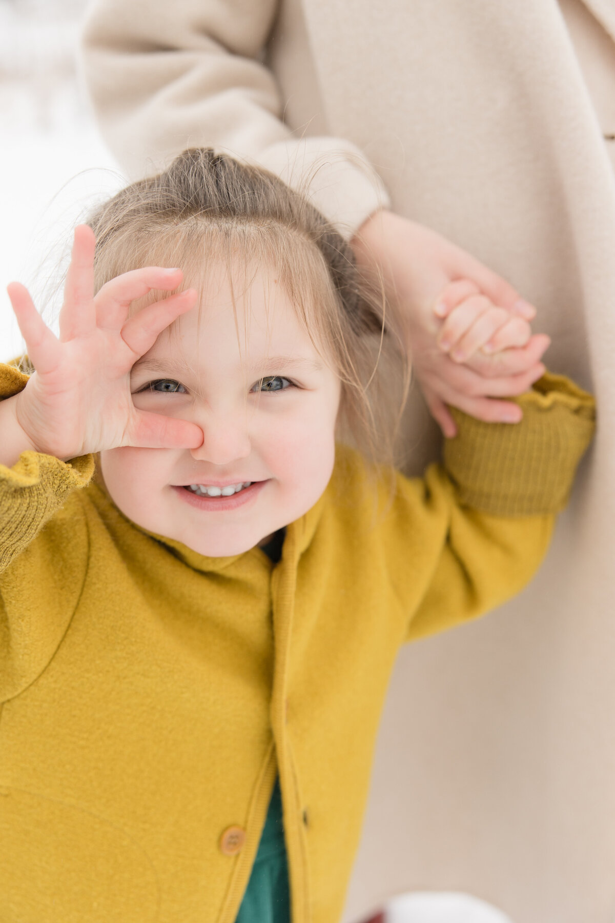 A young girl looking at the camera and smiling