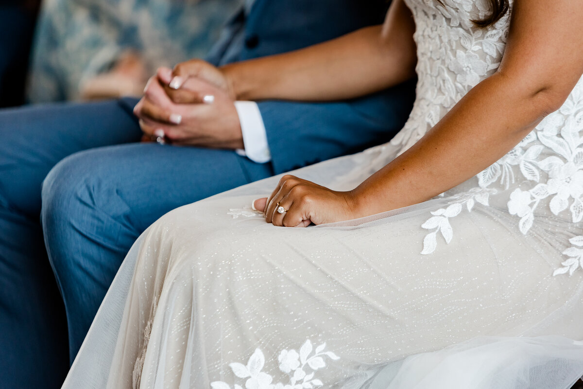 Detailed close-up of wedding rings captured by Style & Grace Photography in Lincoln County, MO, highlighting the intricate designs and the symbol of the couple’s love and commitment.