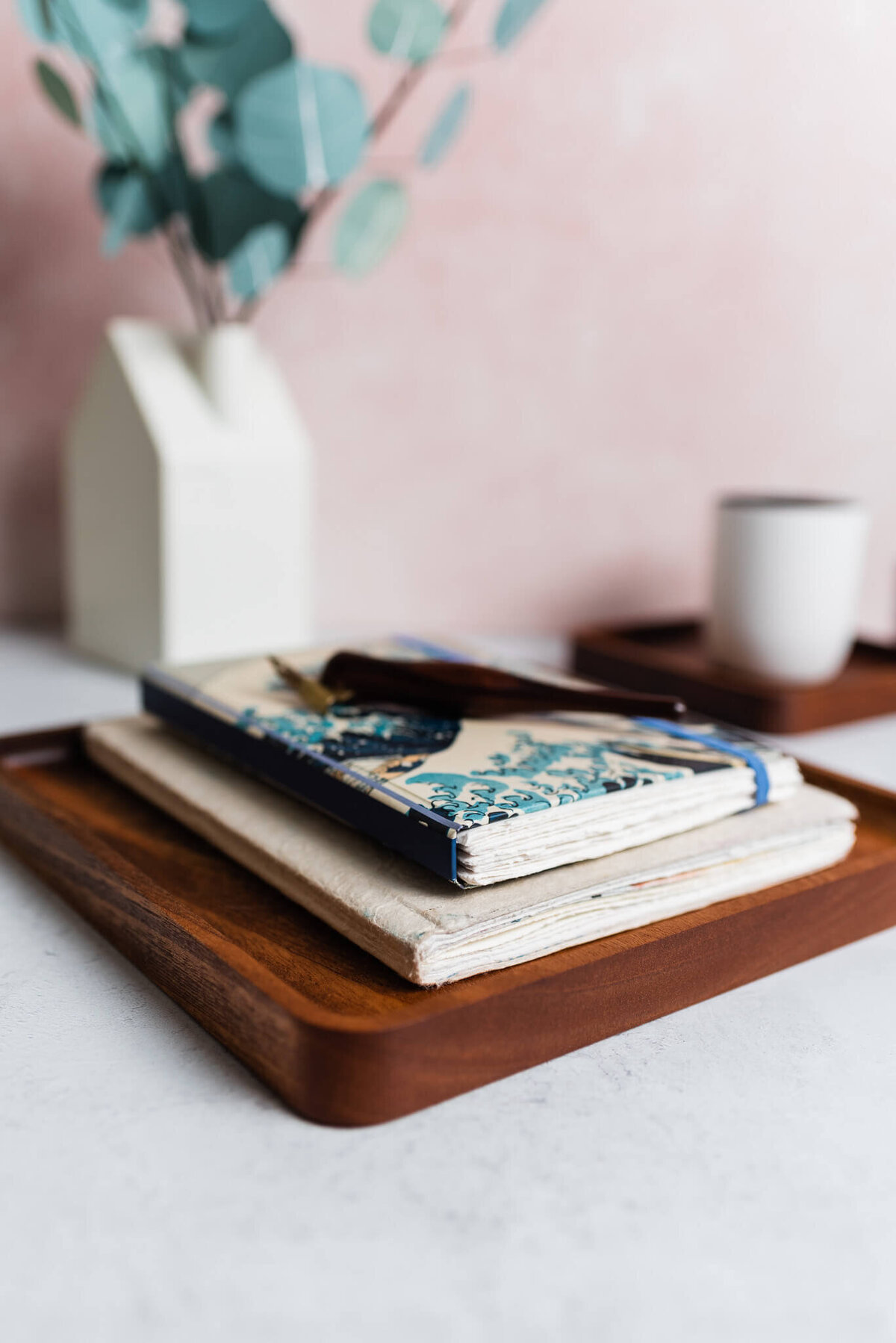 books on a wood tray