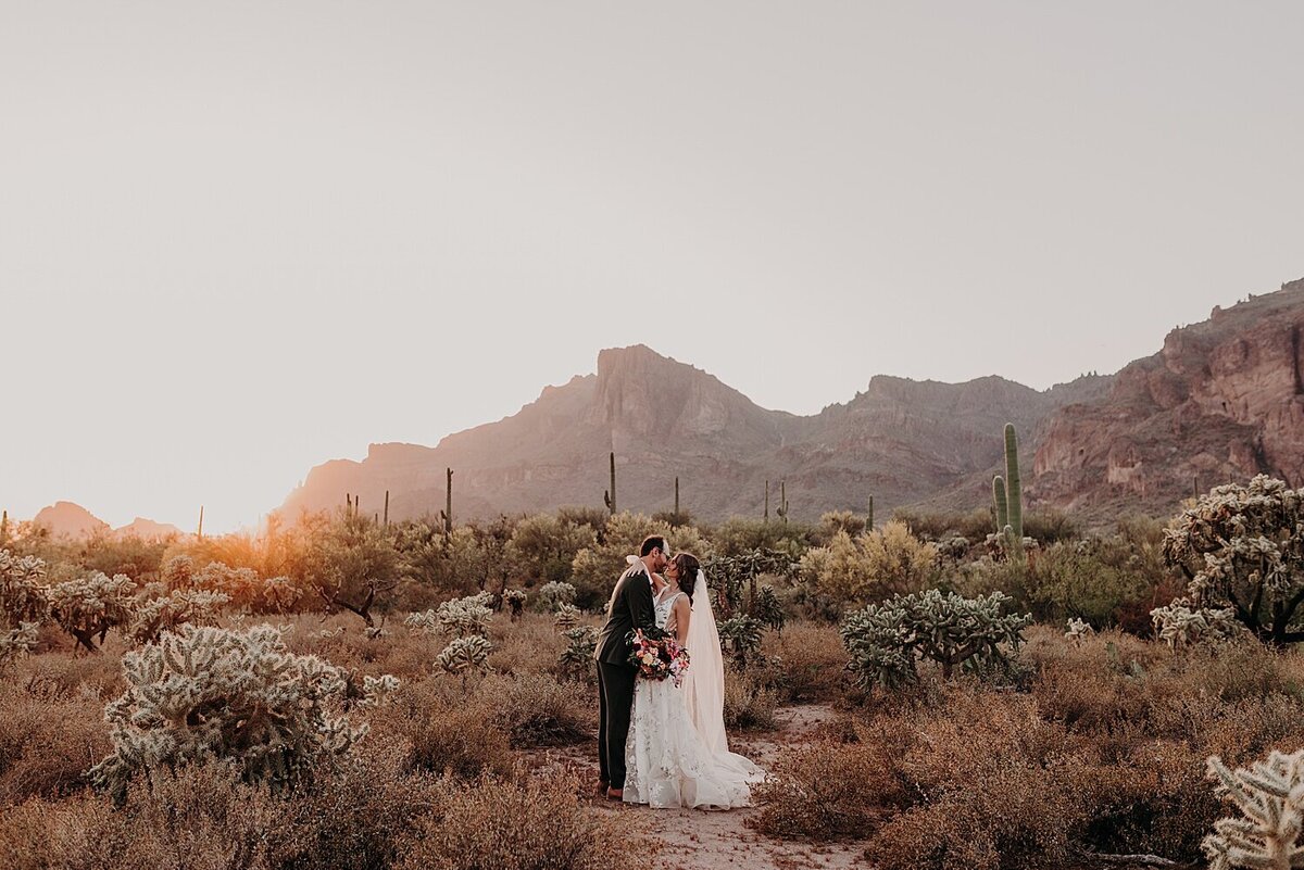 Bride and Groom embrace during sunset in the phoenix desert