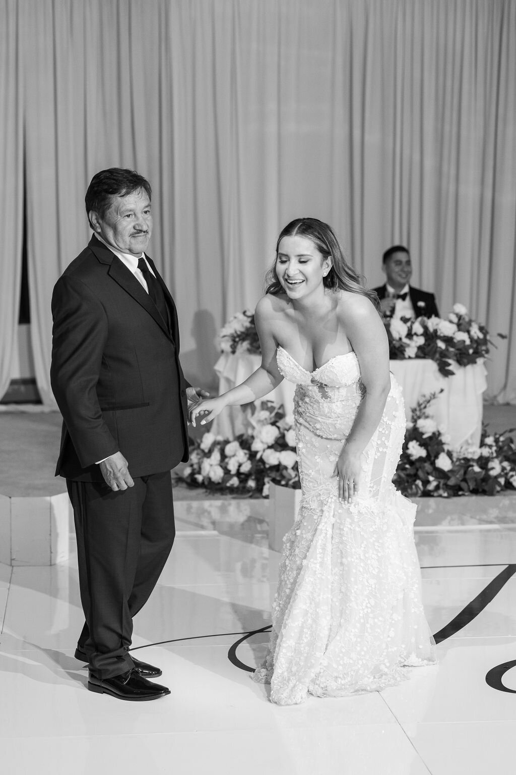 Bride smiling with her father