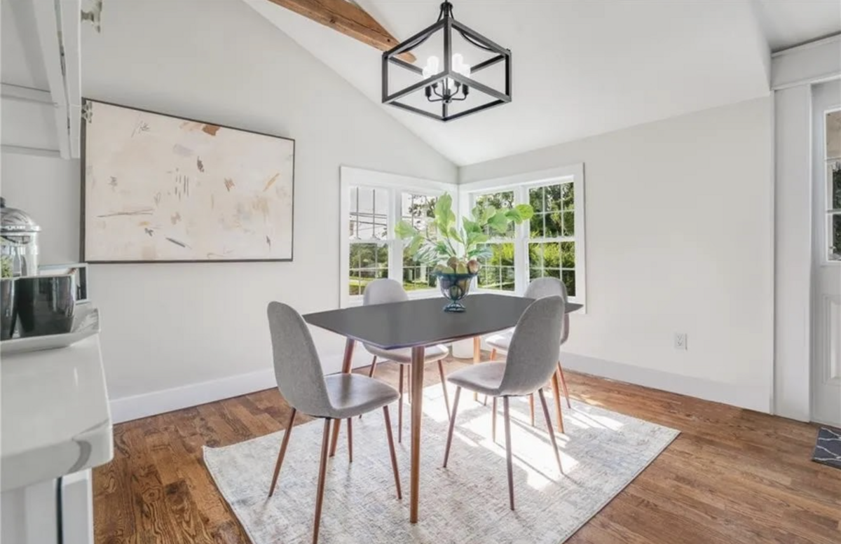 dining room with grey chairs and white accents