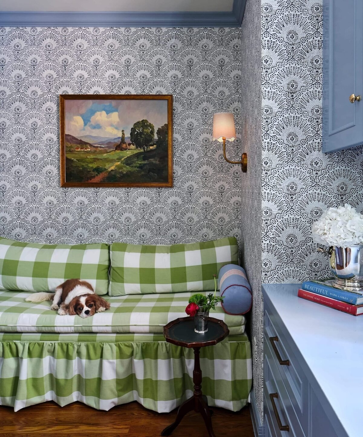 the keeping room interiors morningside wallpaper and blue painted cabinets with dog on couch