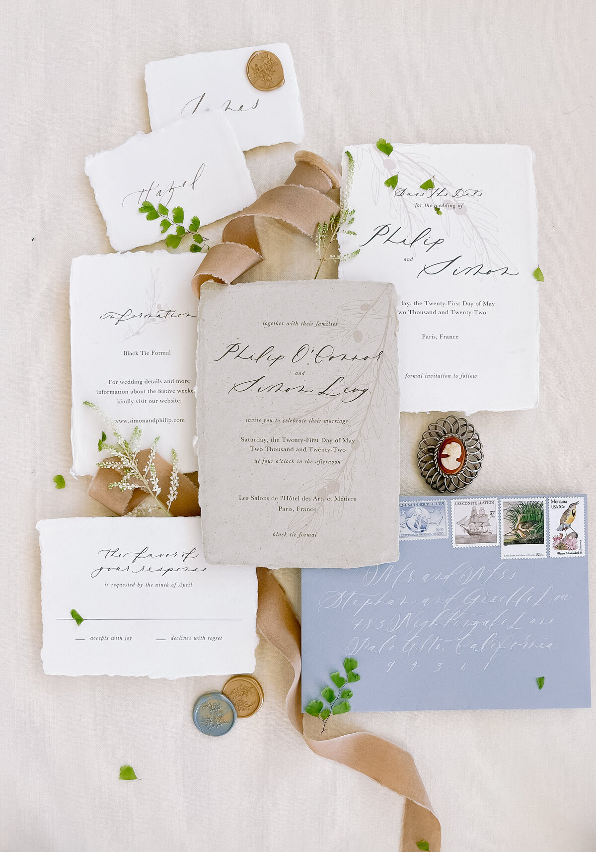 Handmade paper wedding invitations with place cards and silk ribbon