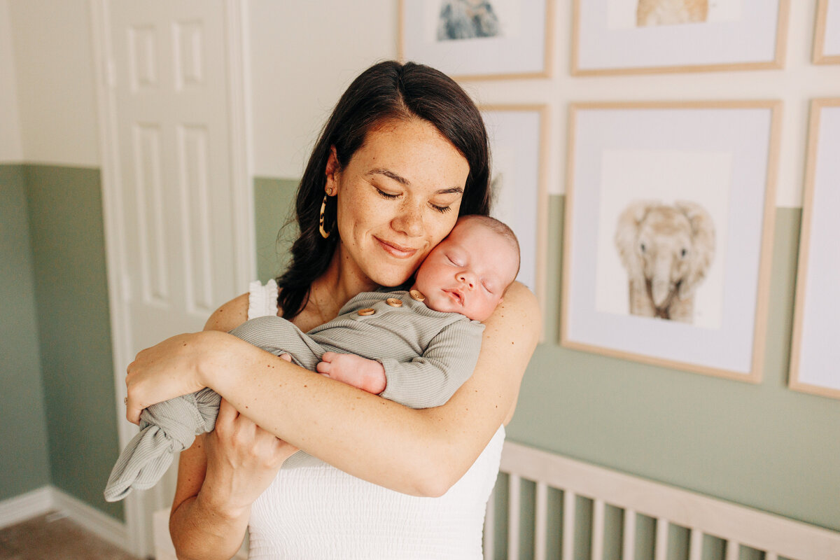 mother and her newborn baby boy taken by  Houston newborn photographer