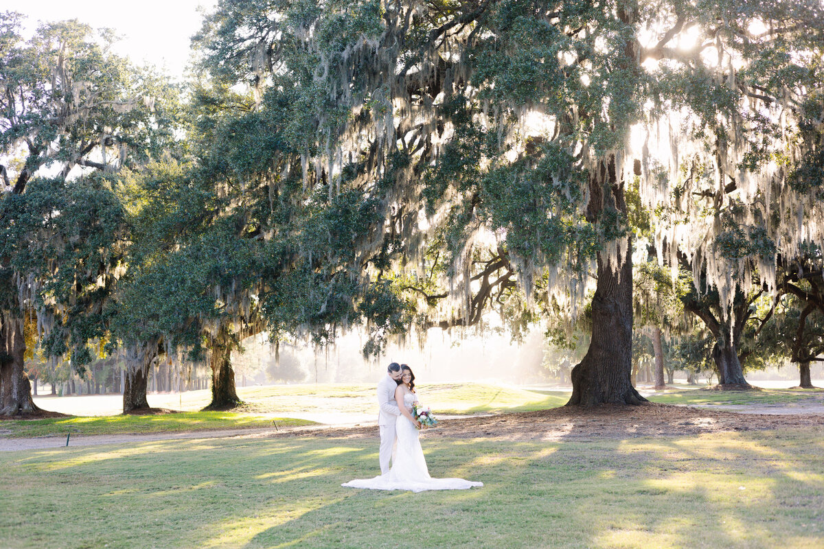 Captivating bride and groom embraced in a moment after their wedding ceremony in Myrtle Beach, South Carolina. Photograph taken by rae Jones Photography