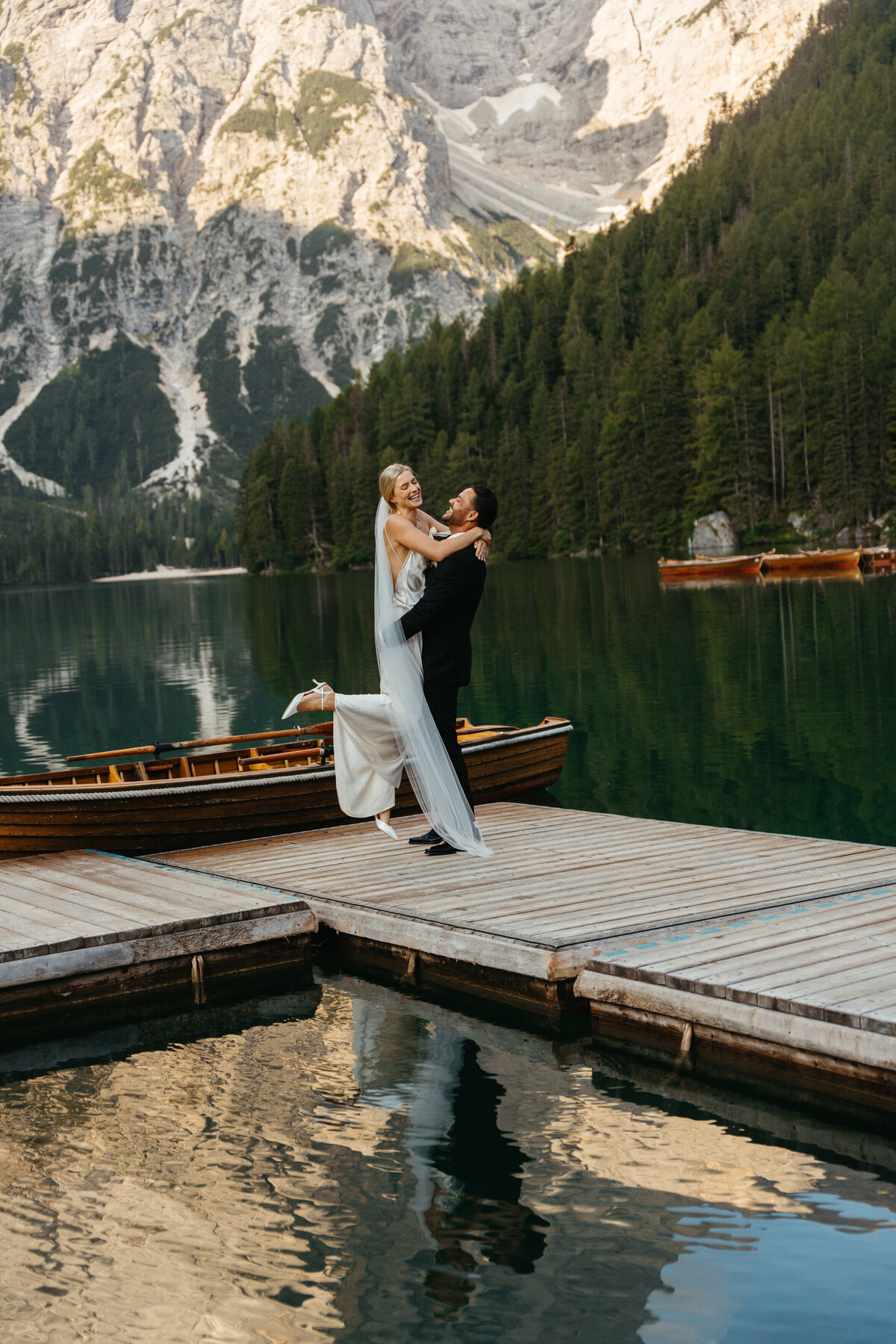 Scenic view of Lago di Braies docks surrounded by mountains