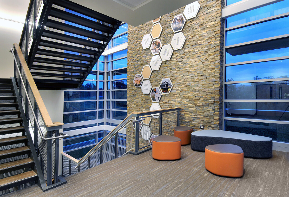 interior stair lobby with donor wall graphic  at The Walker School Warren science & technology building