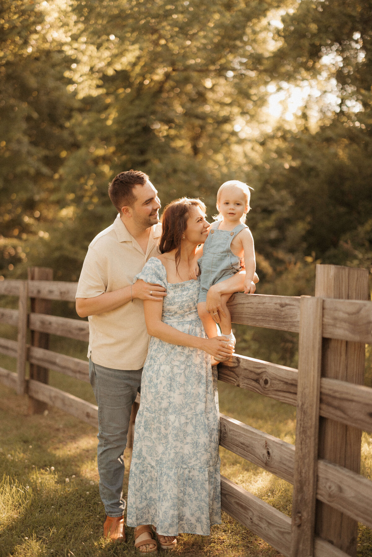 Family playing in grassy meadow during Nashville Tennessee family session