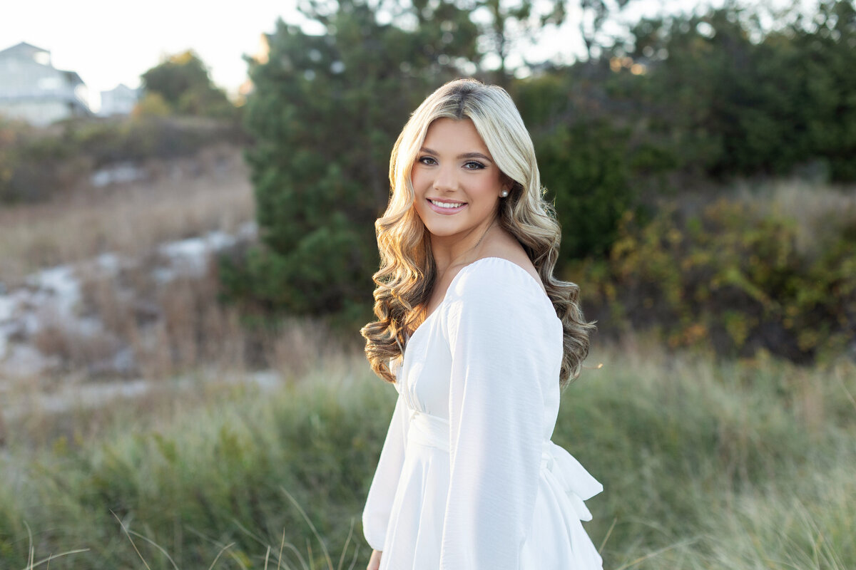 Senior girl on beach in white dress