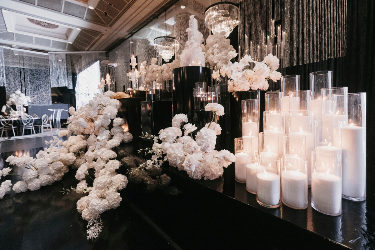 kavita-mohan-black-white-reception-candles-flowers-cake
