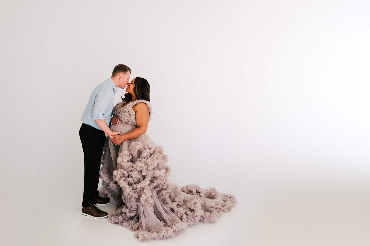 pregnant couple kissing captured by Springfield MO maternity photographer Jessica Kennedy of The XO Photography