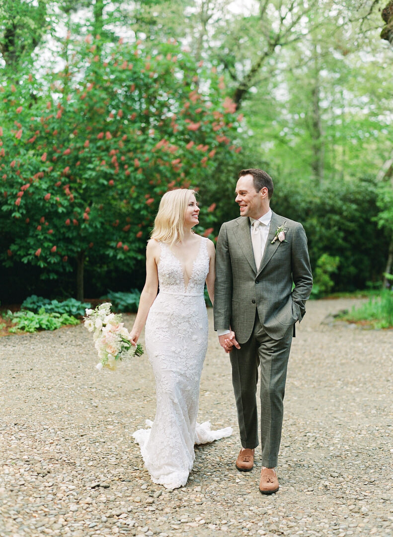 Bride and Groom Holding Hands Walking at Hutchinson House at Old Edwards Inn Photo