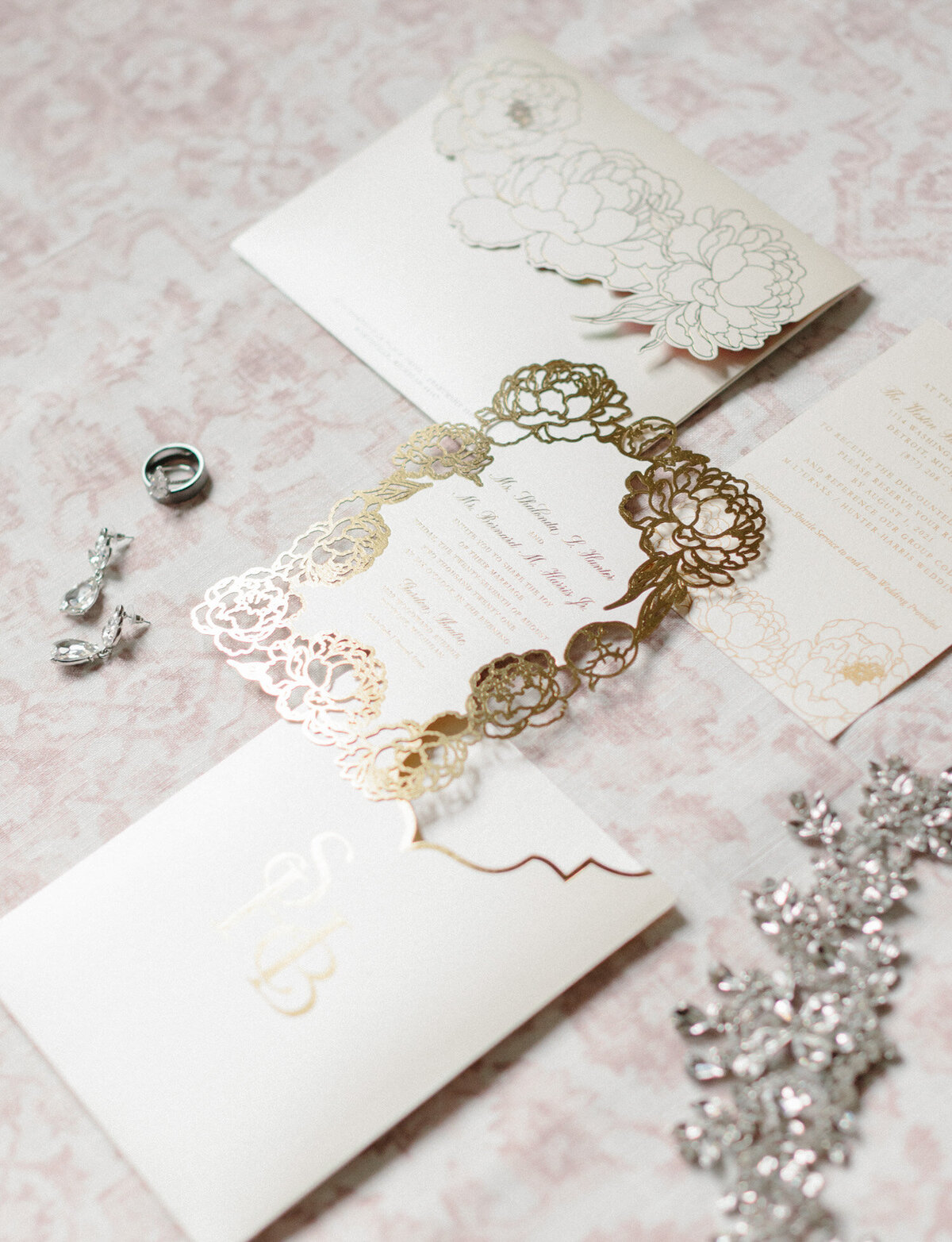 wedding stationery with gold foil detail, floral detail, wedding jewelry