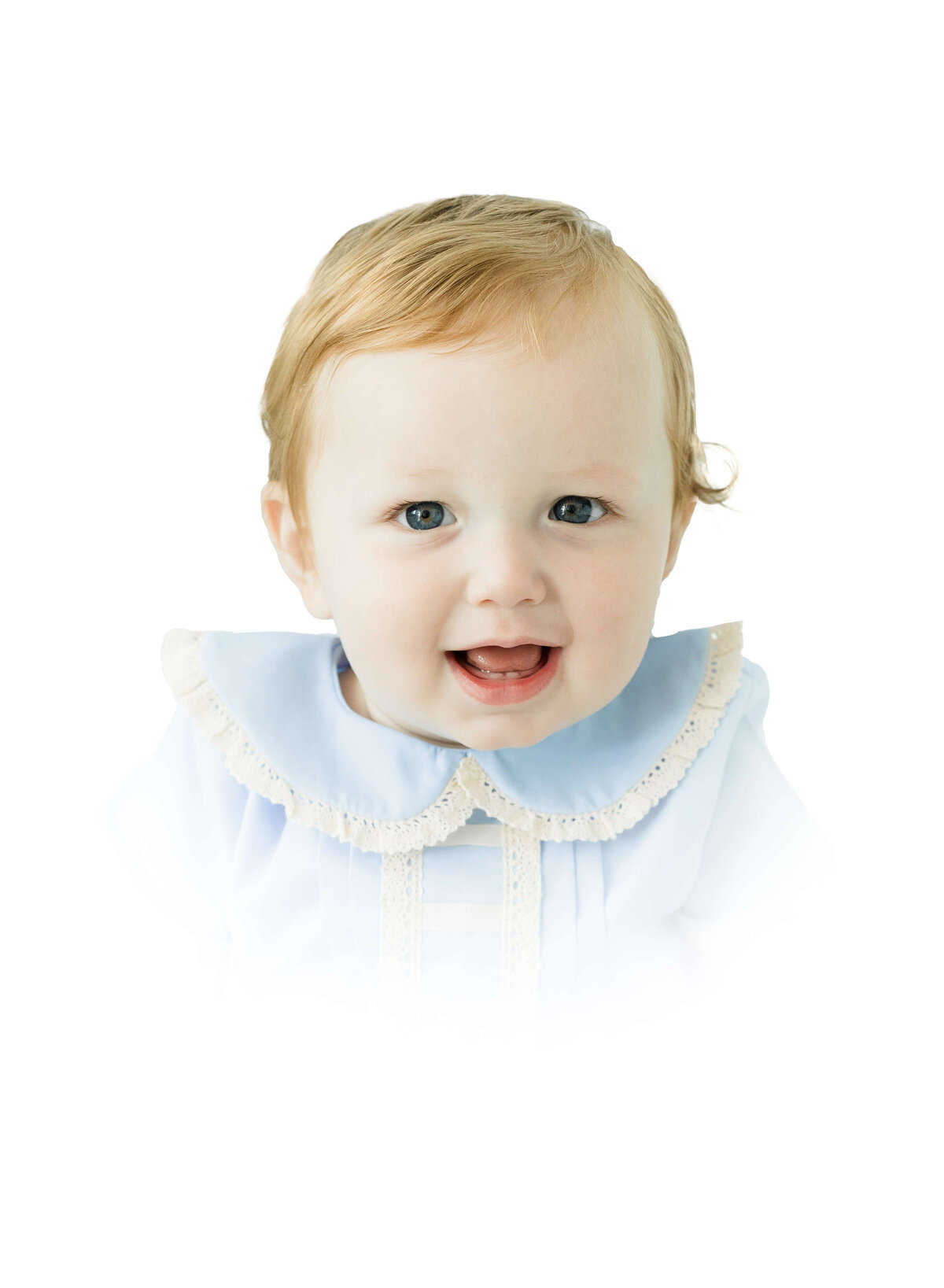 Baby in blue heirloom outfit smiling at the camera for Heirloom Photography in Dothan Alabama Studio