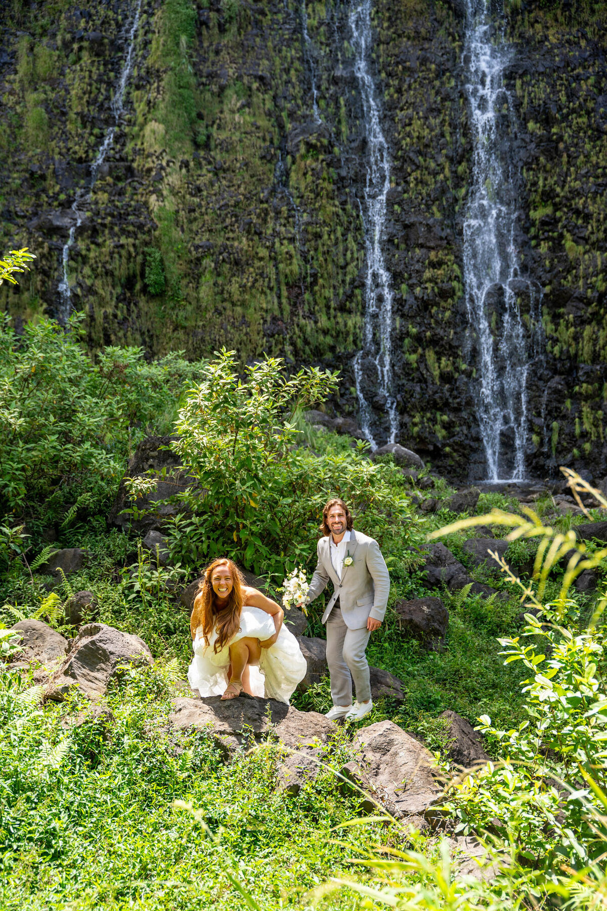 Couple crouching in the mountains, by kona hawaii wedding photographers
