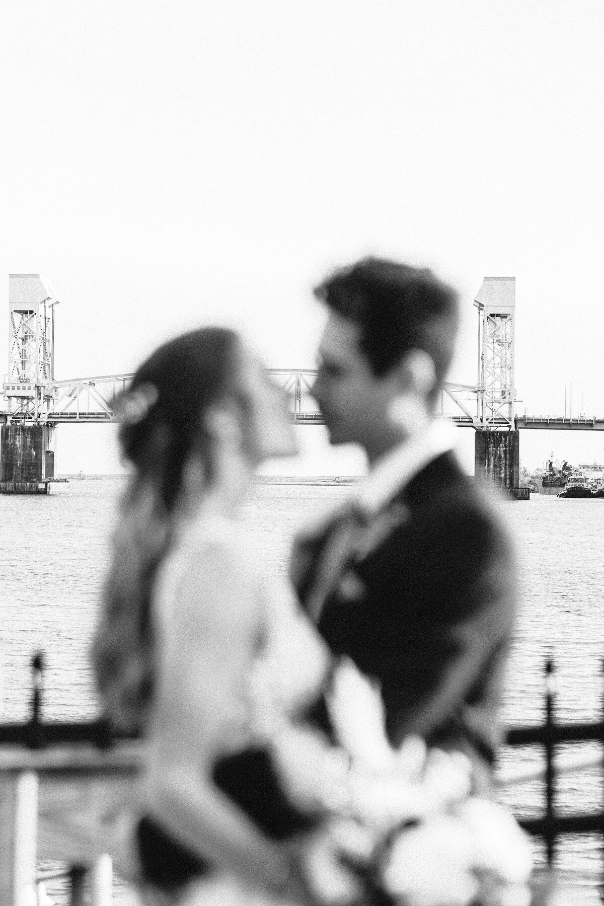 wedding photo in downtown wilmington with scenic bridge over cape fear river in downtown wilmington wedding photography