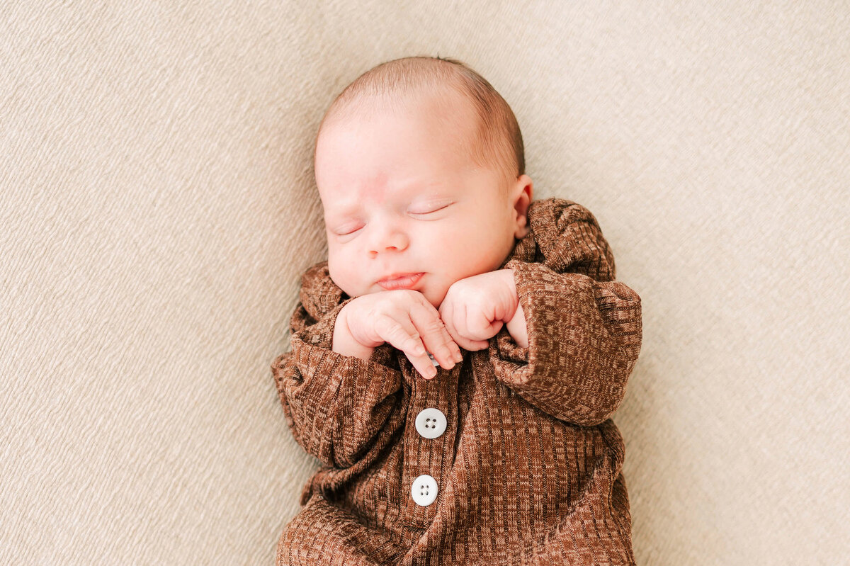 baby boy sleeping in bed captured by Springfield MO newborn photographer The XO Photography