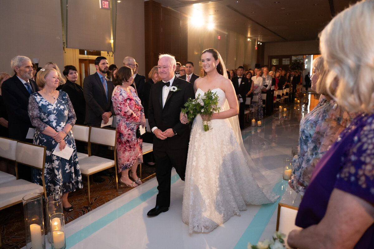 Bride walking down the aisle for her wedding ceremony at Union Station Dallas
