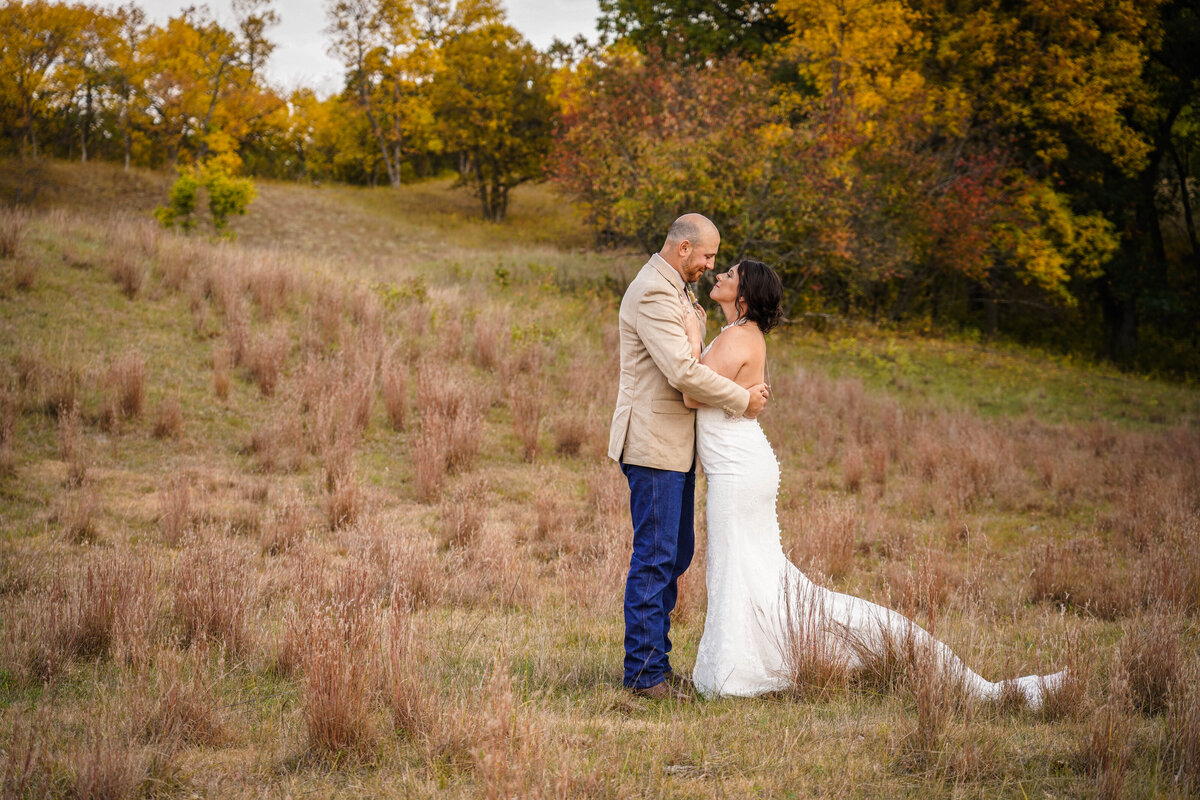 western wedding couple in a fall pasture