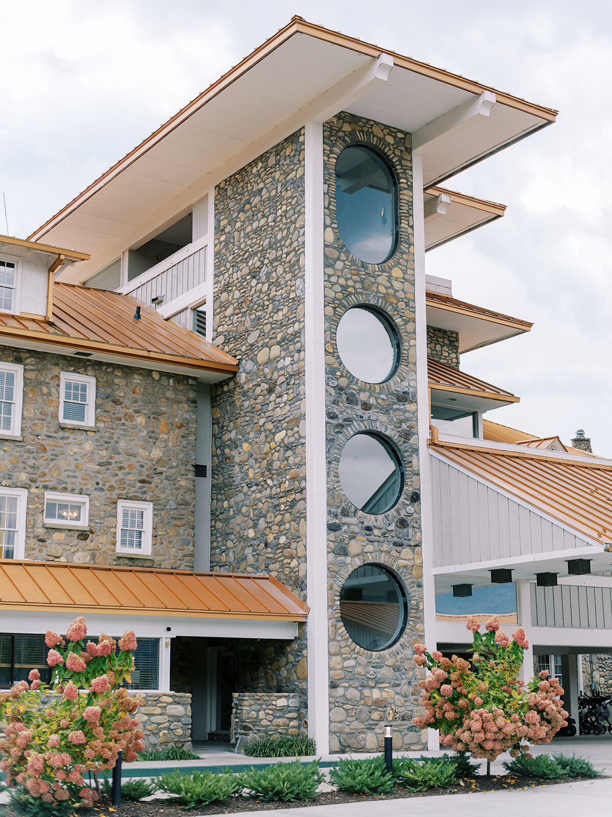 Stone tower and modern architectural details at Waynesville Inn and Golf Club wedding venue in Waynesville, North Carolina.
