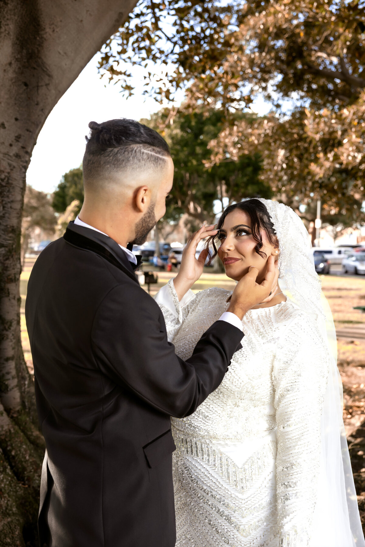 Groom Fixing Bride’s Hair – Candid Arabian Wedding Photos in Los Angeles