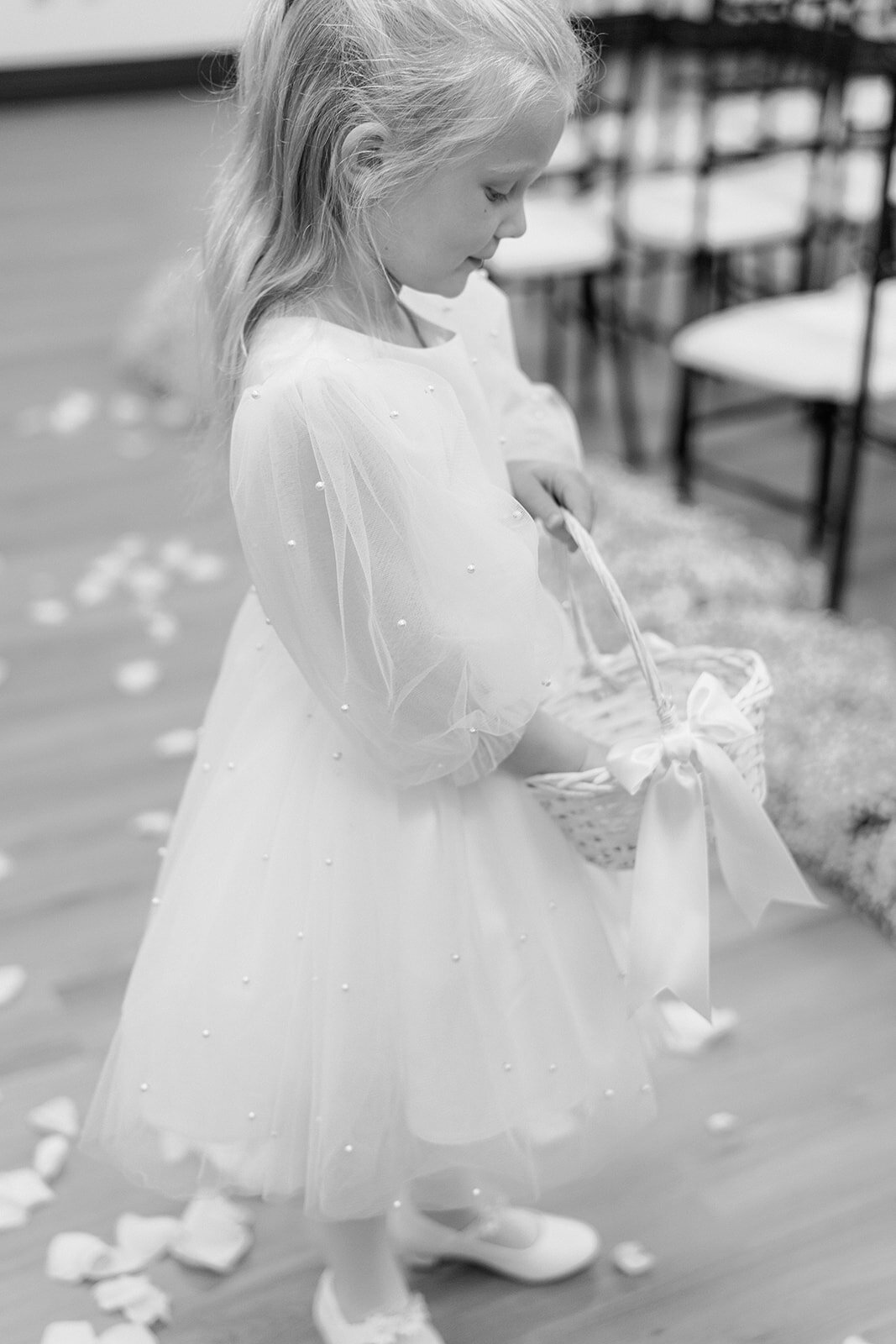 Flowergirl at a wedding ceremony in a Columbus venue shot by a Philadelphia wedding photographer