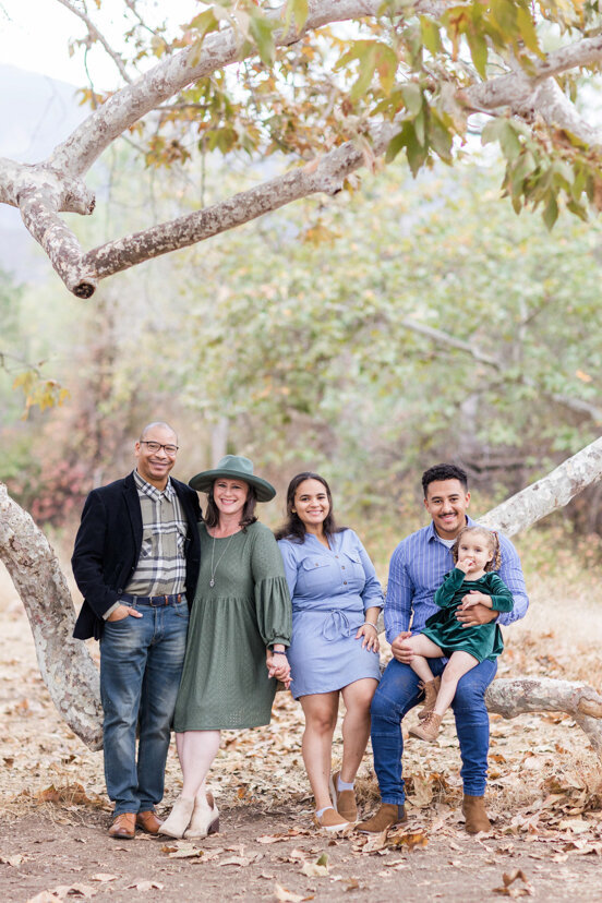family-sitting-on-branch-under-tree--sweetwater-river-bridge-san-diego
