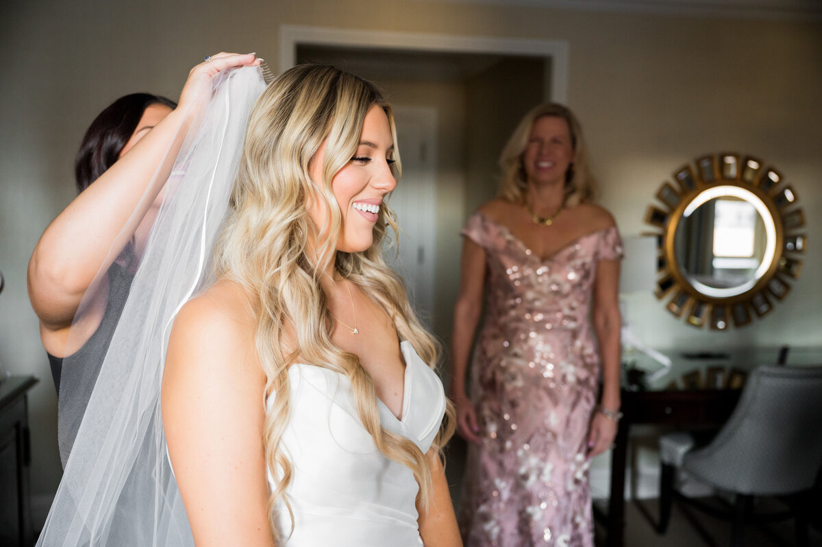 putting on wedding veil
