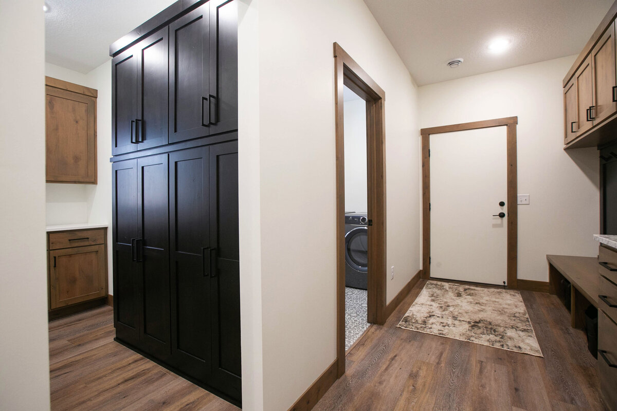 Back Entry with wood flooring and built in lockers n a custom-built Elk River home