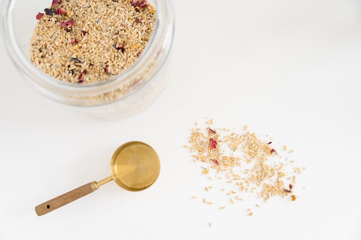food photography by Columbus photographer ofgrains scooped out on a white counter with a gold scoop