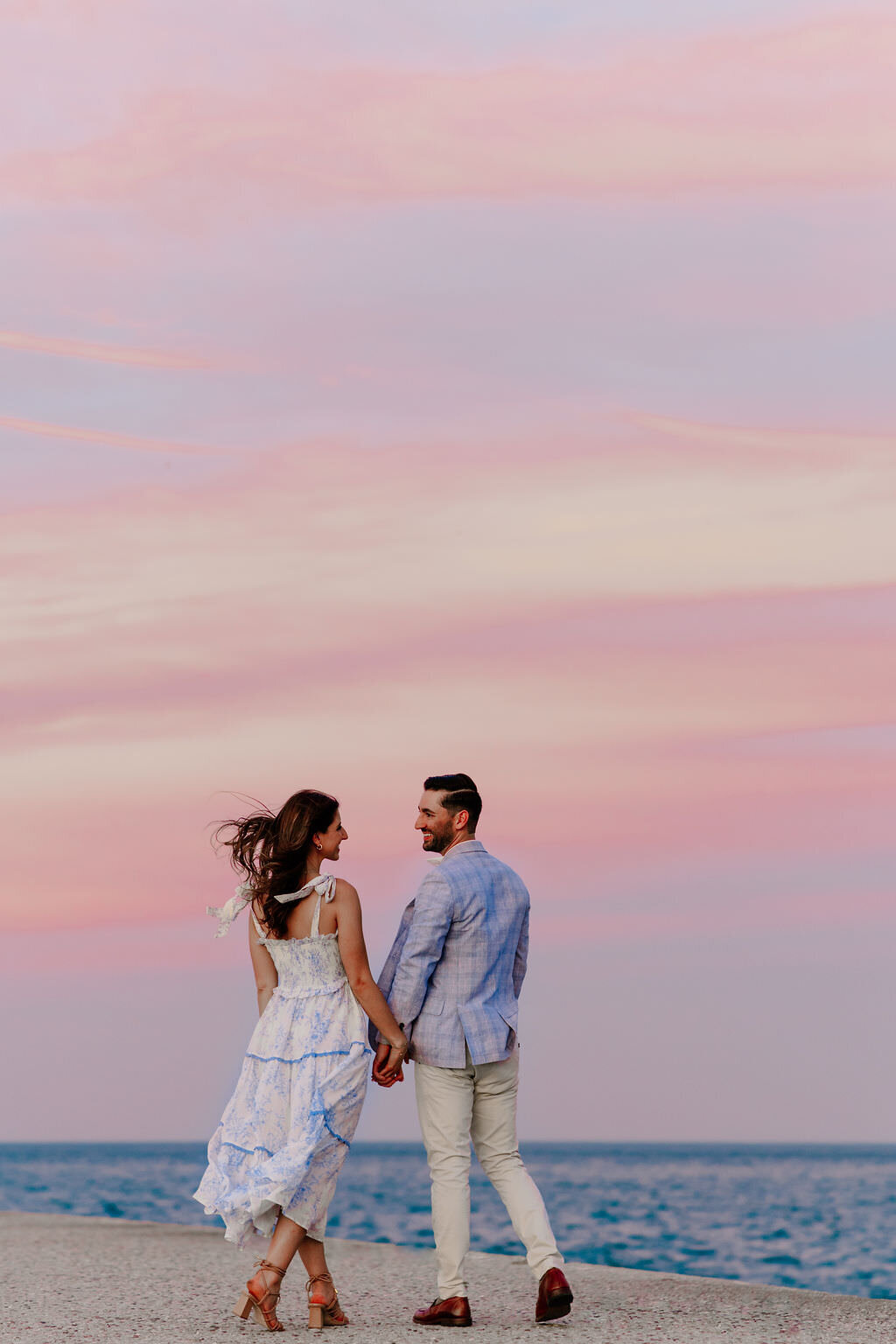 An engagement photography session at The Wrigley Building and North Ave Beach in Chicago, Illinois - 45