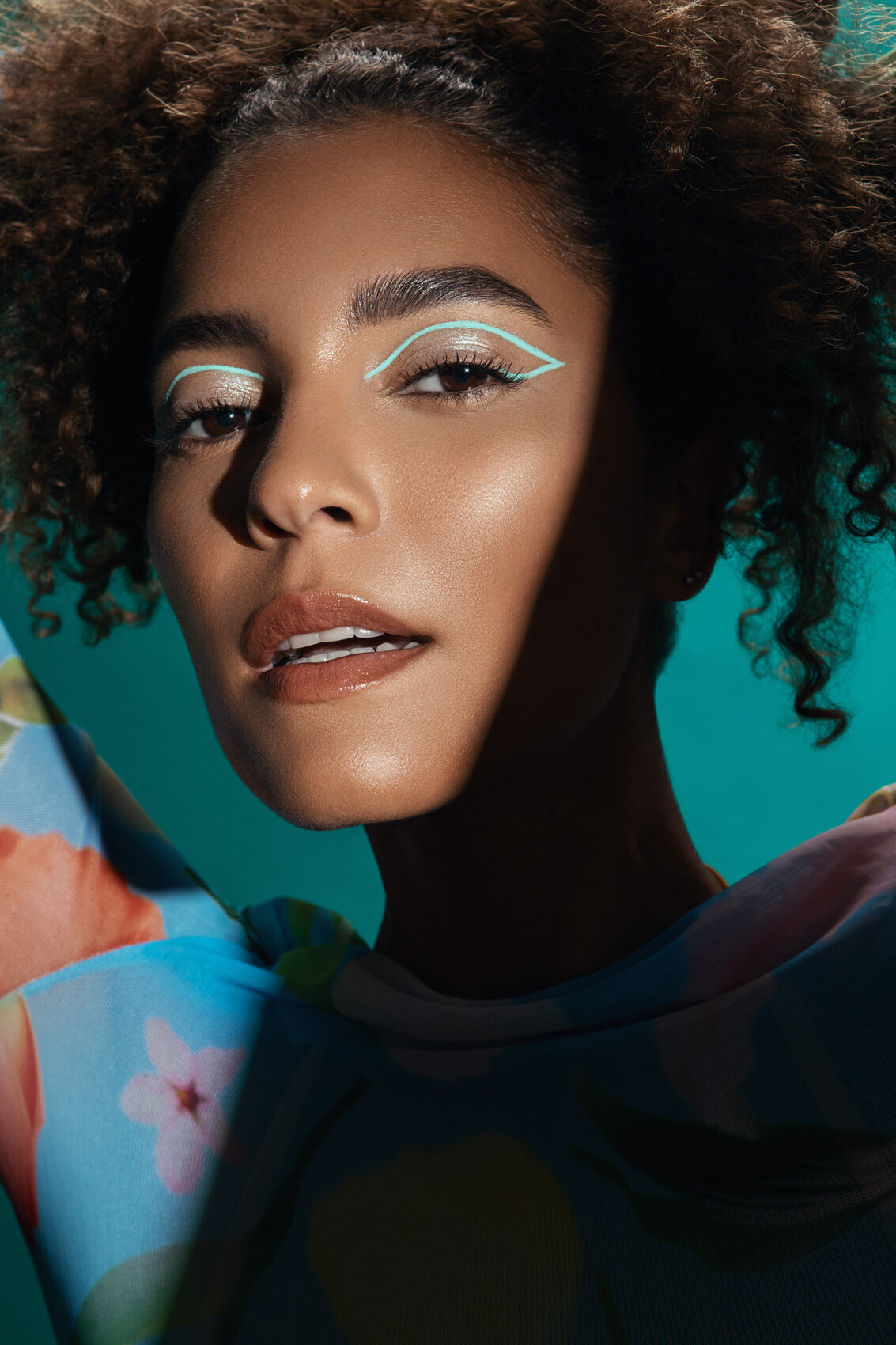 Creative portrait of Angelica Artifex with artistic makeup and vibrant colors, captured by Ylva Erevall.