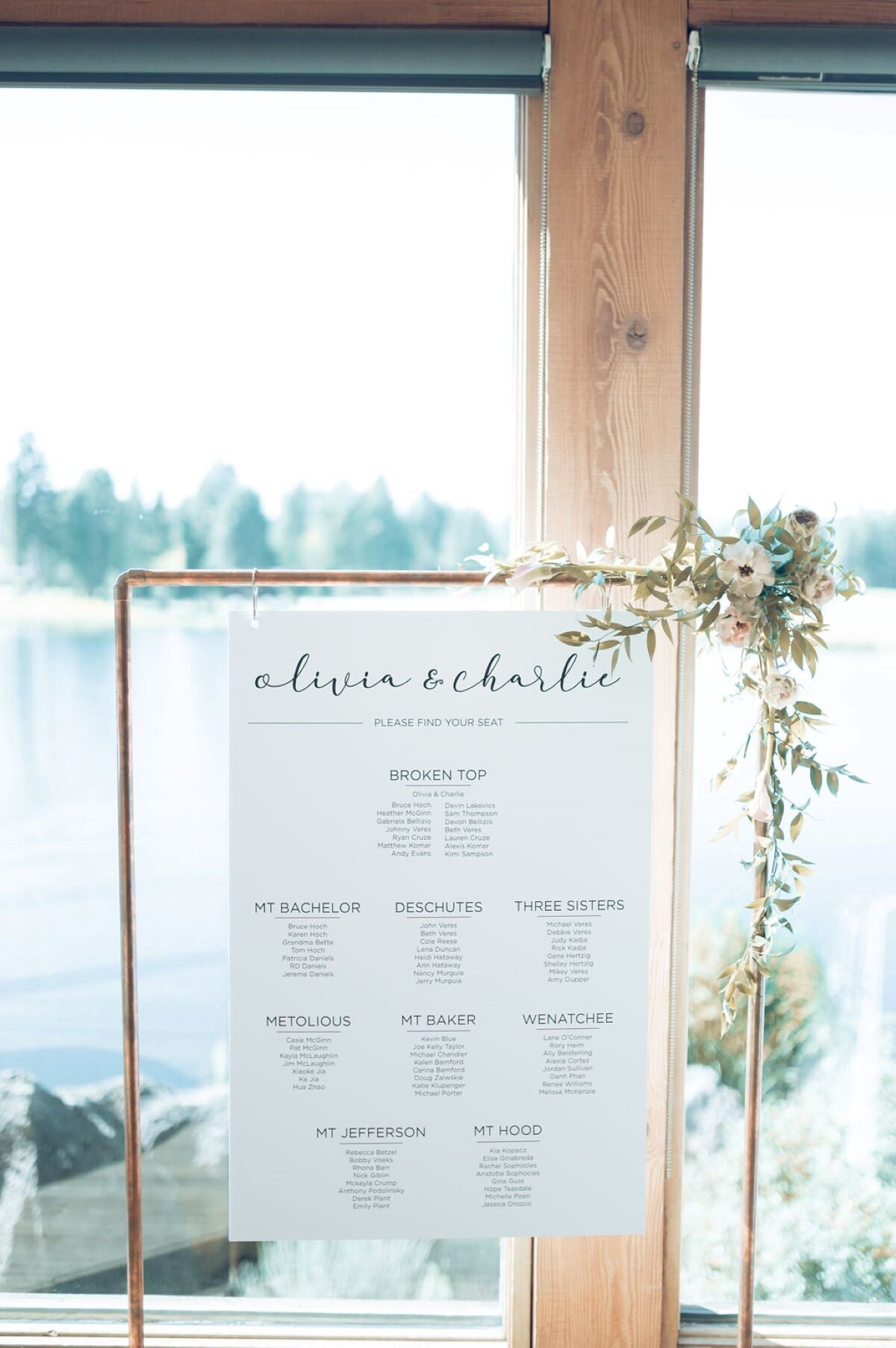 Seating chart sign on copper pipe base with small floral accent at Broken Top Club in Bend Oregon